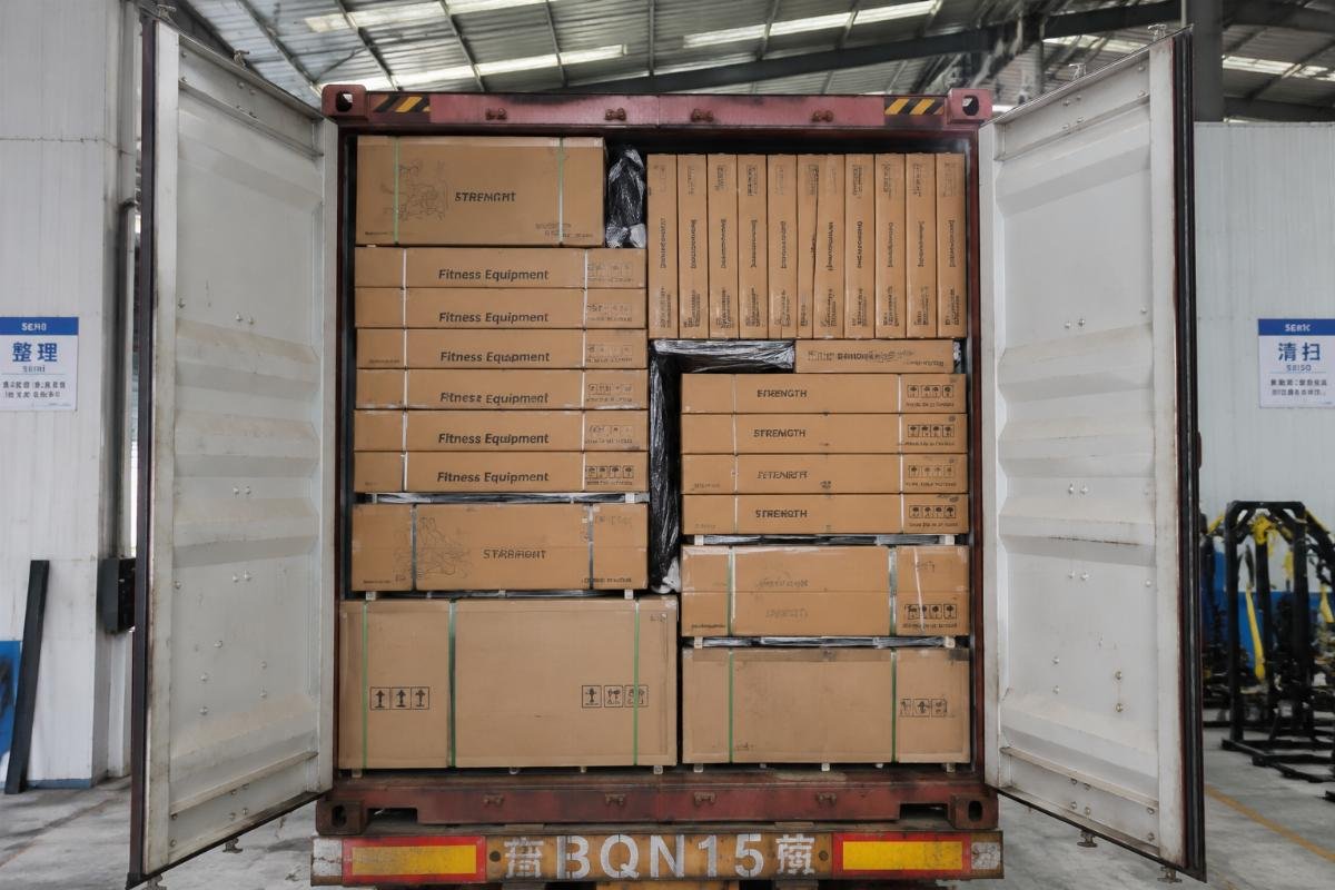 Optimized 40HQ gym equipment container loading Stacked gym equipment packages neatly arranged inside a 40HQ container at a factory warehouse